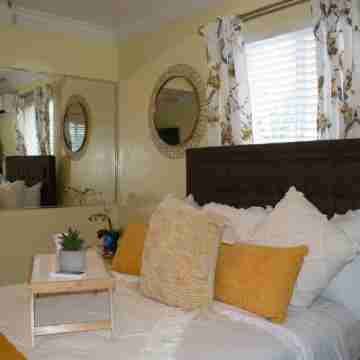 Entire Condominium Home away from Home with Pool, Near Beach Rooms