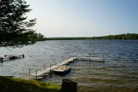 Escape to a cozy cottage on Ausable Lake, in Lupton, Michigan!