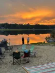 Lakeside Sunsets at this 3-bedroom lake cottage that sleeps 12 on Secord Lake.