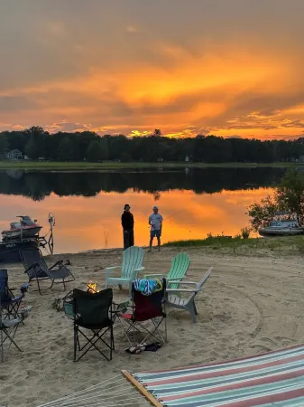 Lakeside Sunsets at this 3-bedroom lake cottage that sleeps 12 on Secord Lake.