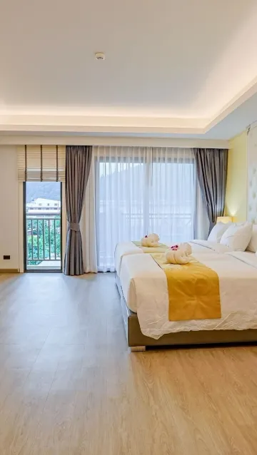 ห้องดีลักซ์สำหรับสามท่านพร้อมระเบียง