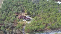 Escape to this serene 4-bedroom home set on 10 private acres.