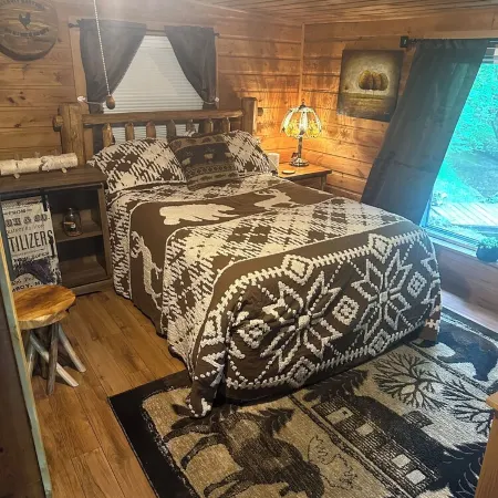 A Stream  runs through it. Comfy little cabin with a stream by your bedroom.