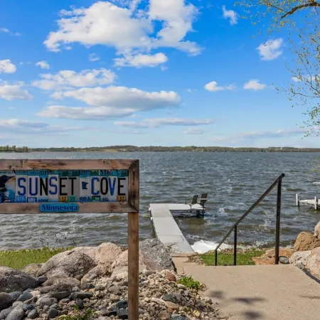 Cozy, year-round lake home with magnificent sunset views, lake access and dock.