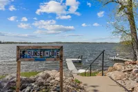 Cozy, year-round lake home with magnificent sunset views, lake access and dock.