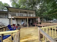 Peaceful lake front home with wrap around porch and relaxing views!