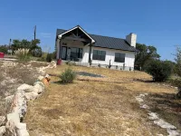 Beautiful Hill Country Charm. 88 acres with mini farm animals.