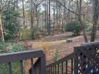 Cozy one level, 2 BR, 2 Bath TH in charming wooded community. Perfect location!