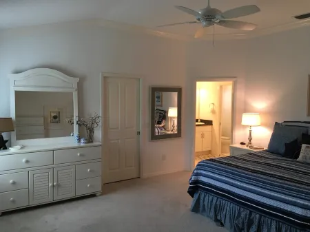 Bright Coastal Decor and Golf Cart - Inviting Luxury Retreat