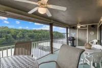 Cozy Condo with Rock Fireplace and Pool - Gorgeous Waterfront Oasis