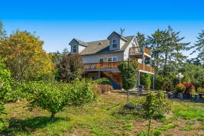 Dog-friendly riverfront retreat with hot tub on 5.2 acres near the beach