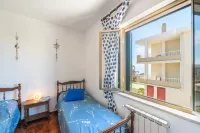 Large seaside apartment with patio in Lu Bagnu Hotels in Lu Bagnu