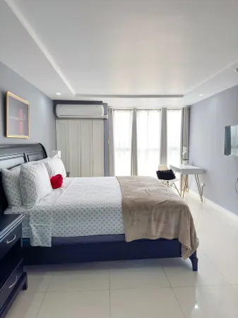 Gated 1-bedroom Condo in Portmore with AC, WiFi, Pool, Kitchen, TV, Beach View