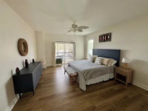 Spacious 7-bedroom, 5-bath home on 168' of a wide, deep-water cove.