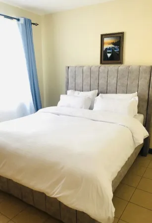 Cozy 2bd Apartment in a serene environment Отели в г. Млолонго