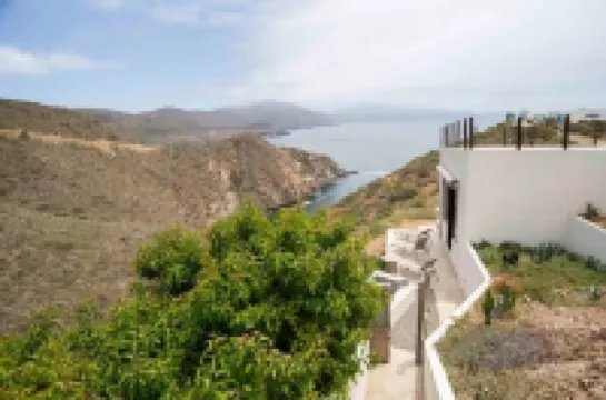 Eclectic Cliffside Den with Hanging Living Area