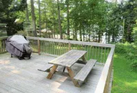 5 bed 4 bath in the Basin of Sebago Lake with 200 ft. of shared beach frontage