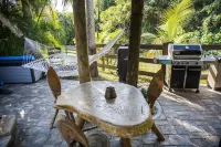 Quaint Pool House in Tropical Setting Hotels near South Florida National Cemetery