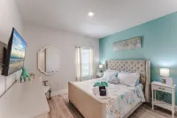Beach House with Golf Cart, Grill & Two Pools!