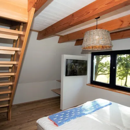 Picturesquely situated thatched-roof house in a large park-like garden