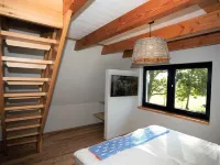 Picturesquely situated thatched-roof house in a large park-like garden