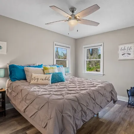 Cozy, year-round lake home with magnificent sunset views, lake access and dock.