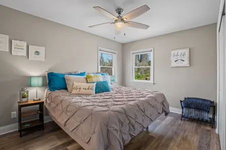 Cozy, year-round lake home with magnificent sunset views, lake access and dock.