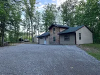CABIN IN THE WOODS  3-2, Sleeps 8, 10 acres, pet friendly  close to ORV trails! Hotels near Roscommon Zoo