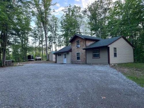 Cabin in the Woods, 10 Acres, Sleeps 8. Close to Orv Trails and Forest Dunes.