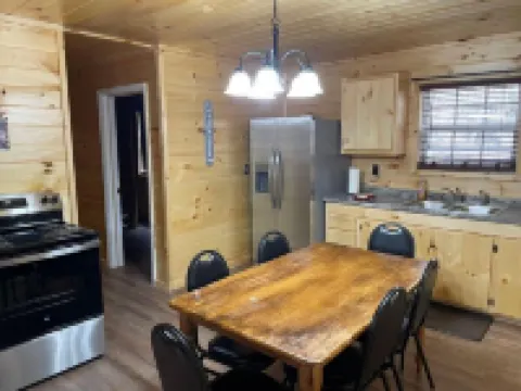 2BR 1 Bath cabin w/ full kitchen, hot tub, and living room.