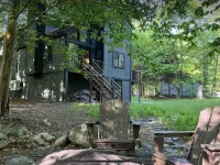 Wooded Retreat in Poconos Mountain Resort w/ Firepit and Kayaks!