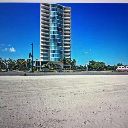 Floor to Ceiling Windows Overlook the Gulf of America's Pristine White Beaches
