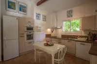 house located in a haven of greenery 15 minutes walk from the beach of Maora