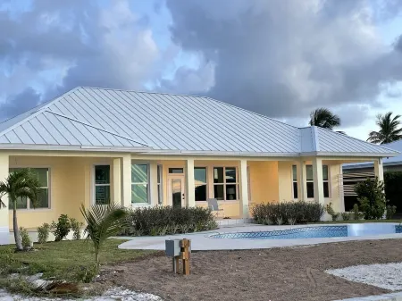 Newly Remodeled Home with Pool on the Harbor with a Beach view an a 22x40 dock.