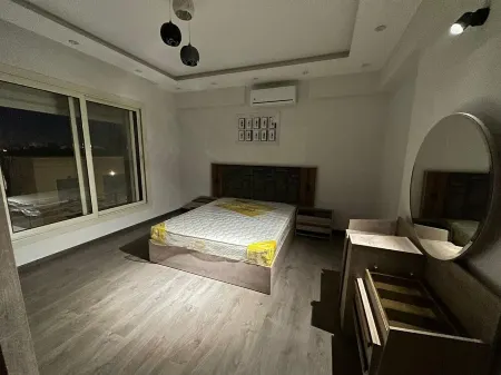 Charming 1-bedroom villa in fabulous Giza Governorate with AC, WiFi Отели рядом с достопримечательностью «St.Samual Church - El Sheikh Zayed City»