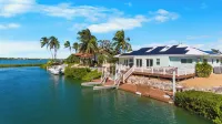Waterfront Home with a Large Dock, Pool, and Deck Area. Can Accommodate Pets.