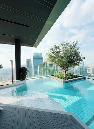 รูปภาพของที่พักหรู 1 ห้องนอน l ห่างจากรถไฟฟ้าบีทีเอส 2 นาที l สระว่ายน้ำและฟิตเนส