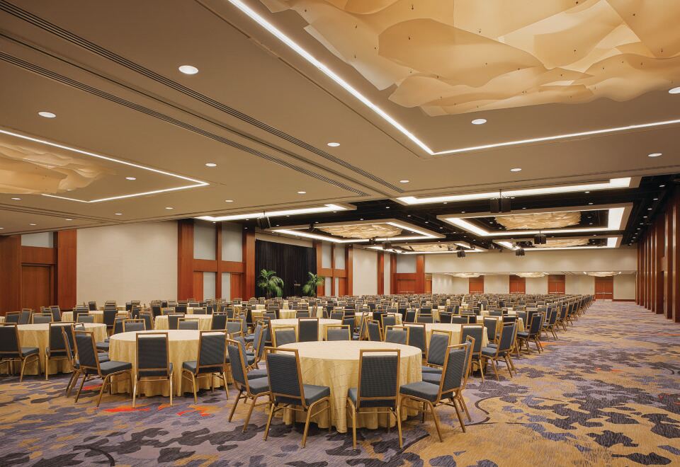 a large conference room with multiple round tables and chairs arranged for a meeting or event at Hilton San Francisco Union Square