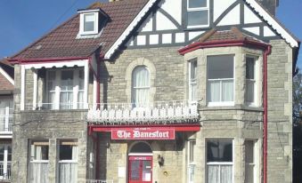 "a brick building with a red and white sign that reads "" the bombery "" is shown" at The Rookery