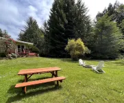 Private mid-century modern hideaway in forest near the river and sea.