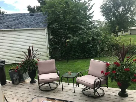 View of Lake Fenton with hot tub and fire place