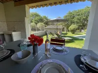 Provencal farmhouse on a hillside surrounded by centuries-old olive and oak trees