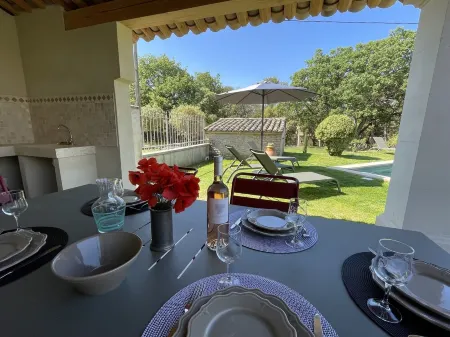 Provencal farmhouse on a hillside surrounded by centuries-old olive and oak trees
