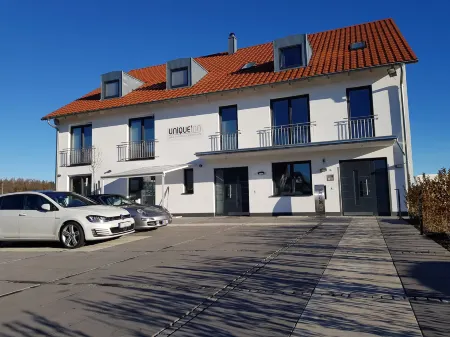 Unique Inn Отели в г. Веслинг