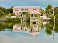 Pink Bikini Island Cottage with a dock on Black Sound