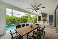 Contemporary Naples Home w/ Outdoor Kitchen & Pool - 3-Star