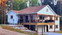 Experience panoramic views in ur 5-bed Frankfort retreat minute to Lake Michigan