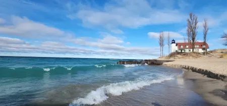 Experience panoramic views in ur 5-bed Frankfort retreat minute to Lake Michigan