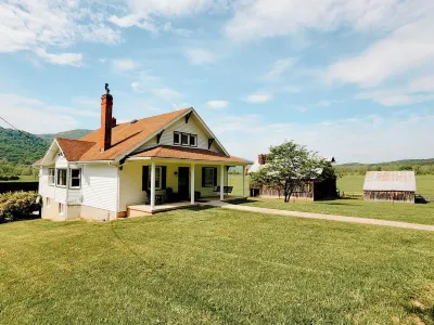 New Listing! Farmhouse along River Rd. with idyllic views and country charm