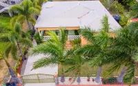 Two bedroom, 2 bathroom house in a tropical palm and garden setting.